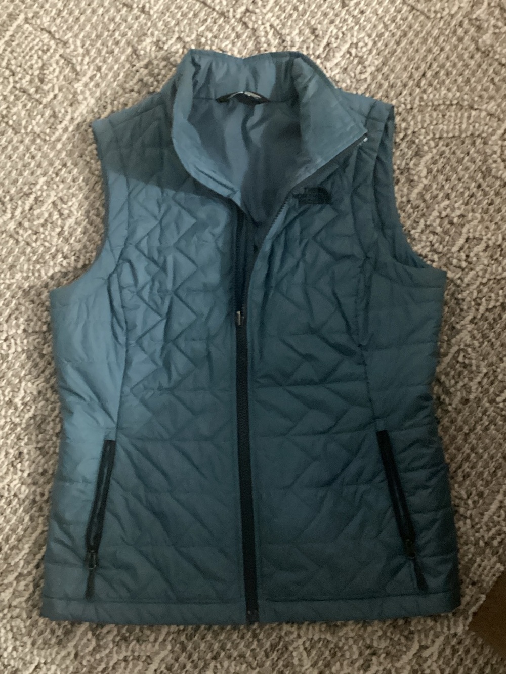 The North Face Quilted Puffer Vest in Teal Blue